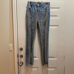 Akira jeans draped in rhinestones. Worn once. Size 7 or 27 waist. No stretch